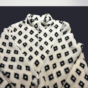 Chic Black and White Diamond Pattern Turtleneck Sweater